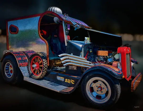 Custom vintage car with exposed engine components.