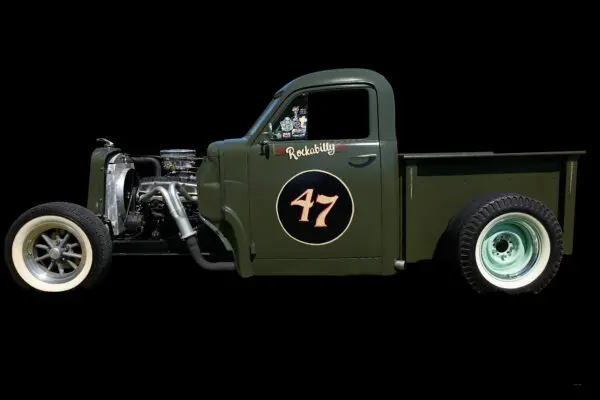 Green vintage truck with number 47 displayed.