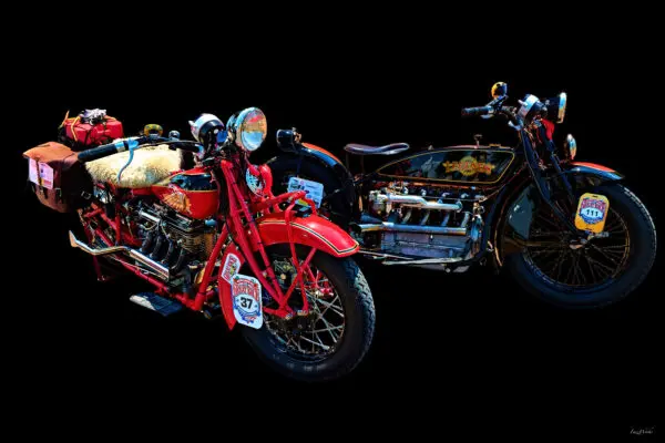 Vintage motorcycles with sidecars on display.
