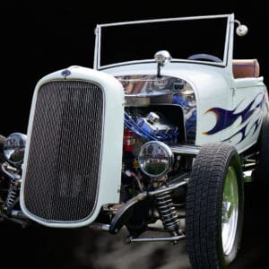 White vintage hot rod with flame decals.