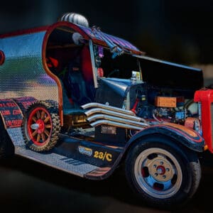 Custom vintage car with exposed engine components.