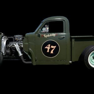 Green vintage truck with number 47 displayed.