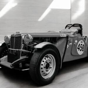 Vintage race car in a showroom.