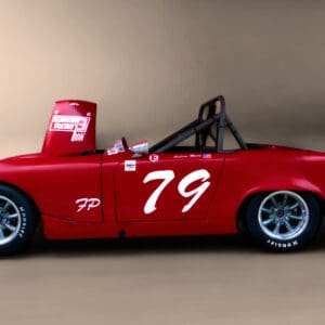 Red vintage race car with number 79.