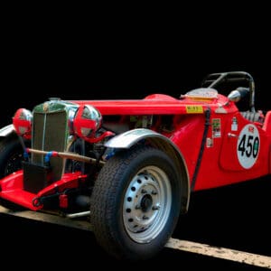 Classic red open-top racing car number 450