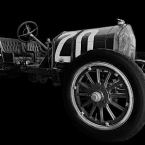 Vintage race car on black background.