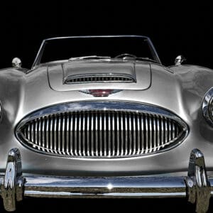 Silver classic convertible car front view.