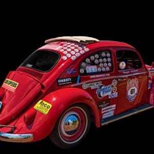 Red vintage car with racing decals.