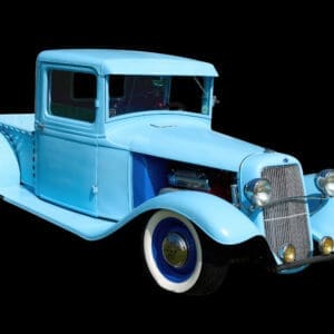 Light-blue vintage pickup truck with whitewalls
