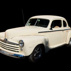 Cream vintage 1940s coupe with chrome trim